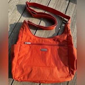 Orange Baggallini handbag. Crossbody or shoulder bag.